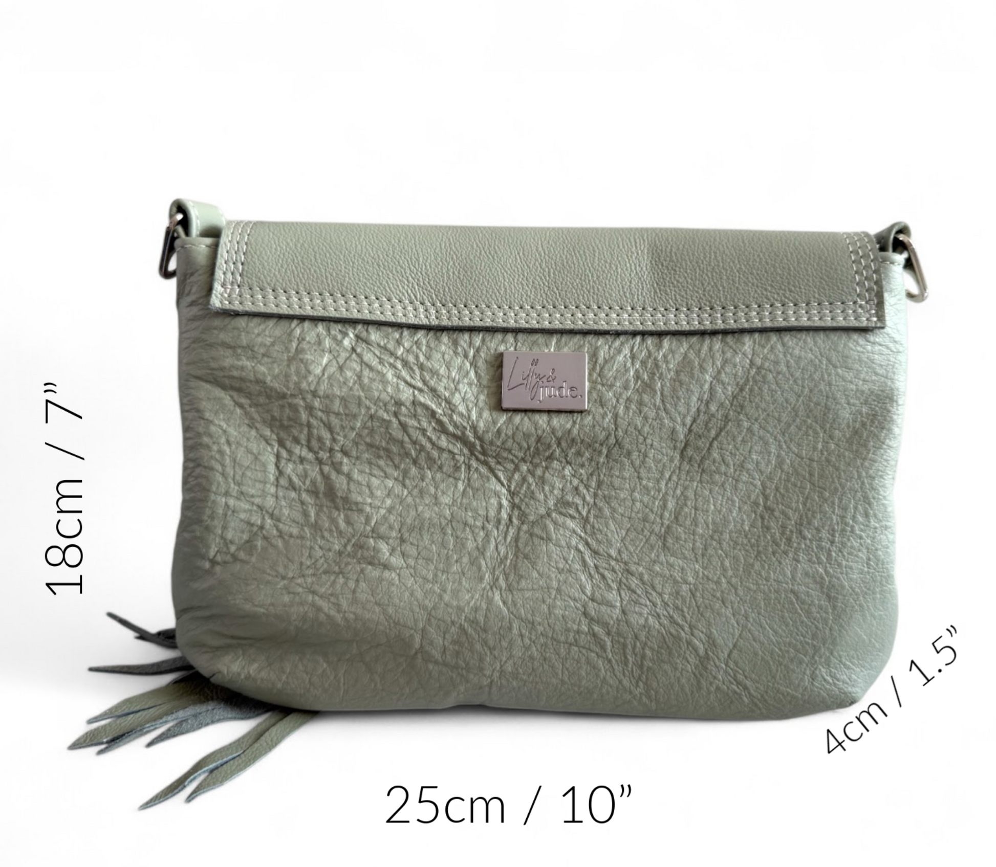 Pale olive green leather handbag with the measurements overlayed to show the size of the bag. This Olivia Crossbody is sitting on a white background
