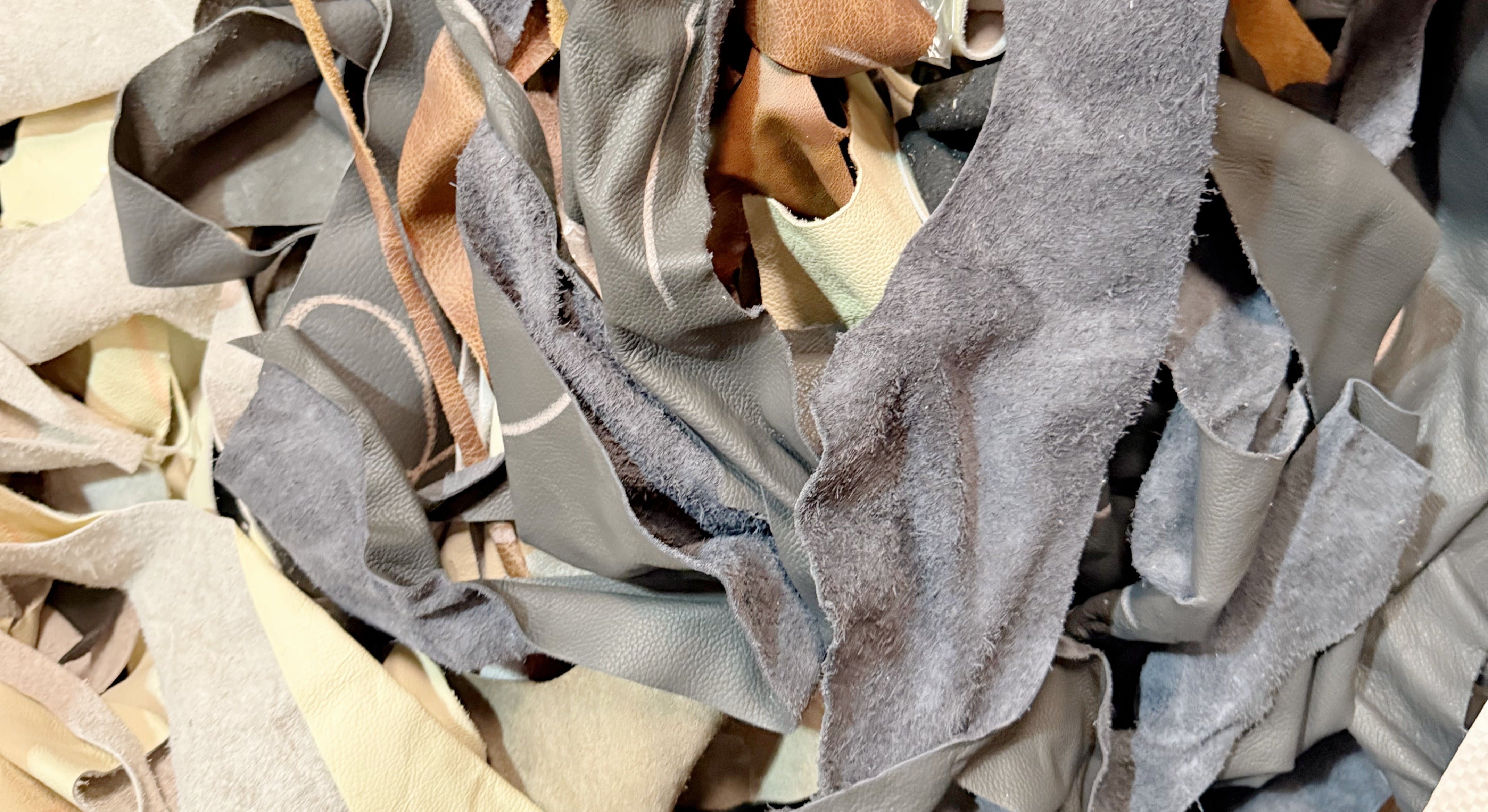 Genuine offcut leather pieces saved from landfill, ready to be transformed into luxury handbags