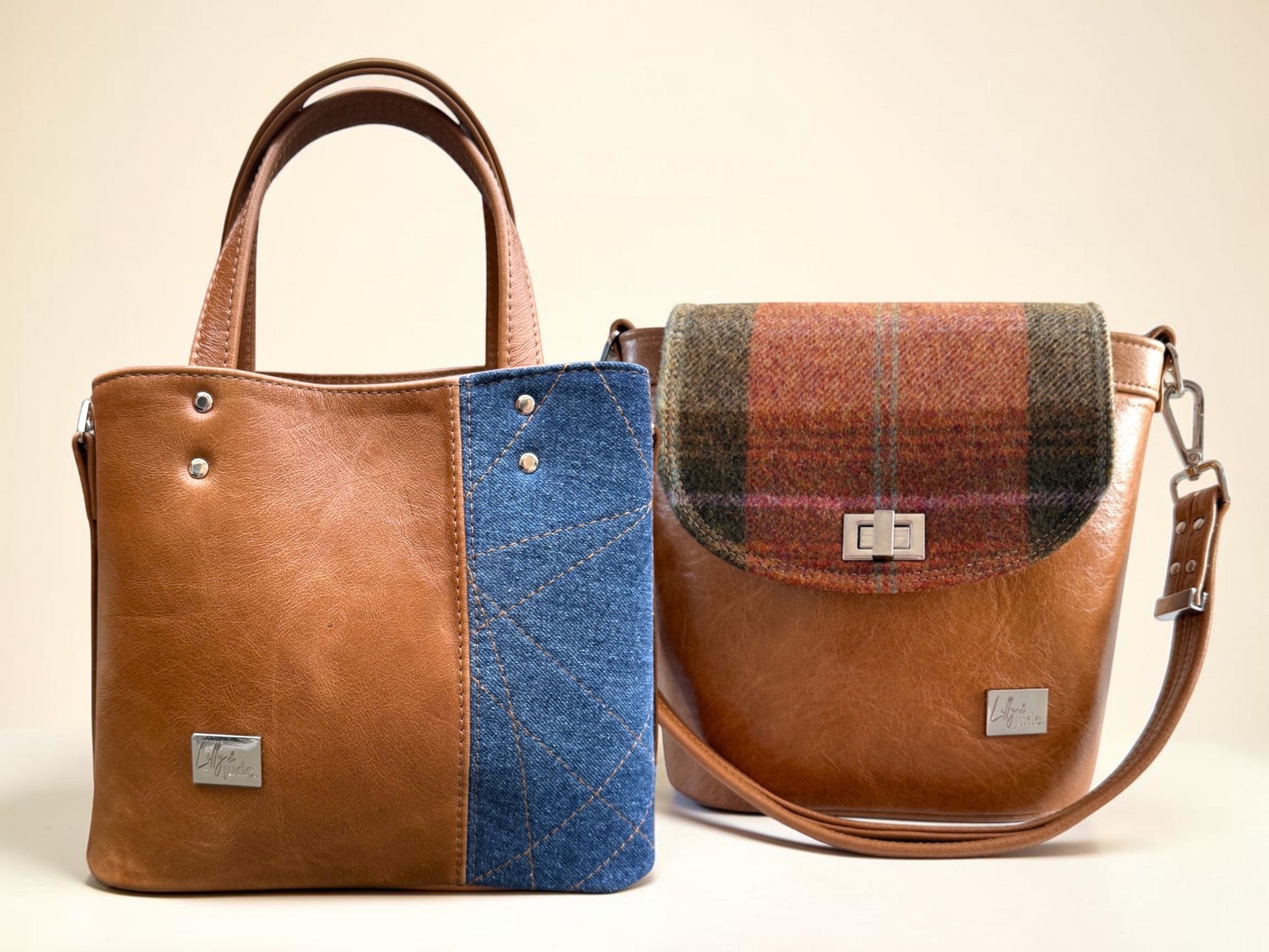 A denim and leather tote bag and a leather and woollen tweed bucket bag on a neutral background