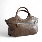 Rear view showing zip pocket on Flossy handbag. This one-off  bag is made from a taupe or grey/beige leather that was rescued from heading to landfill.