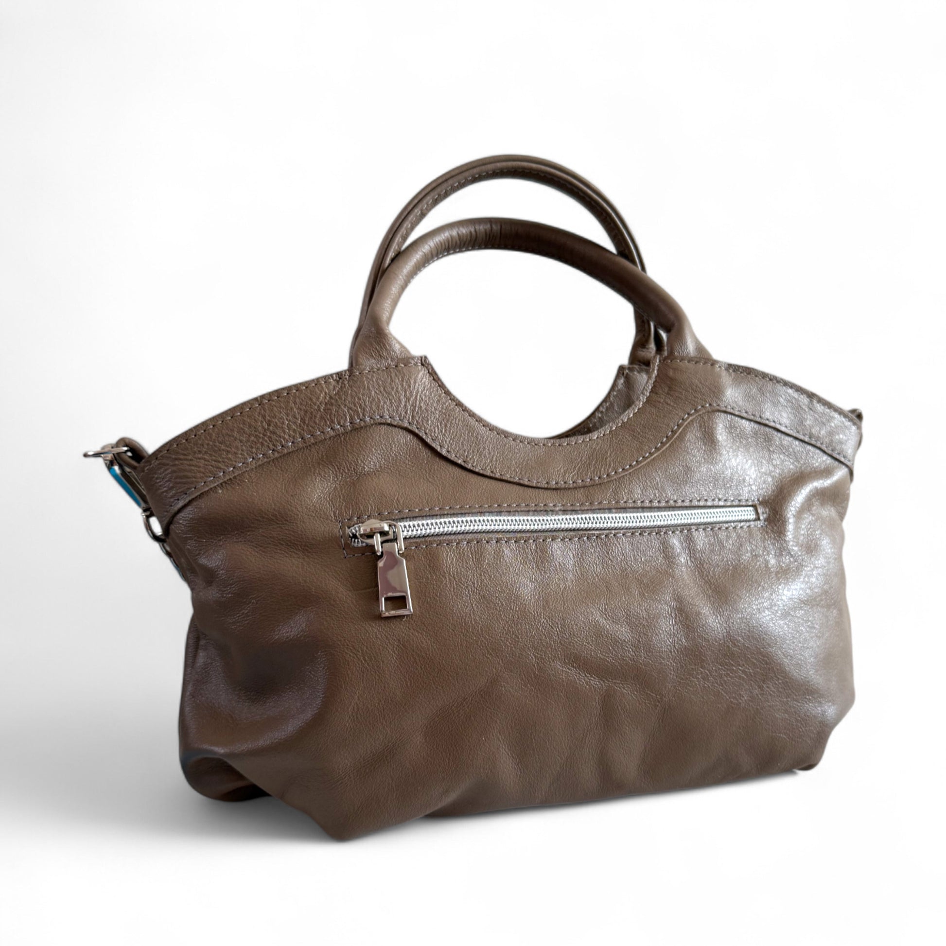 Rear view showing zip pocket on Flossy handbag. This one-off  bag is made from a taupe or grey/beige leather that was rescued from heading to landfill.