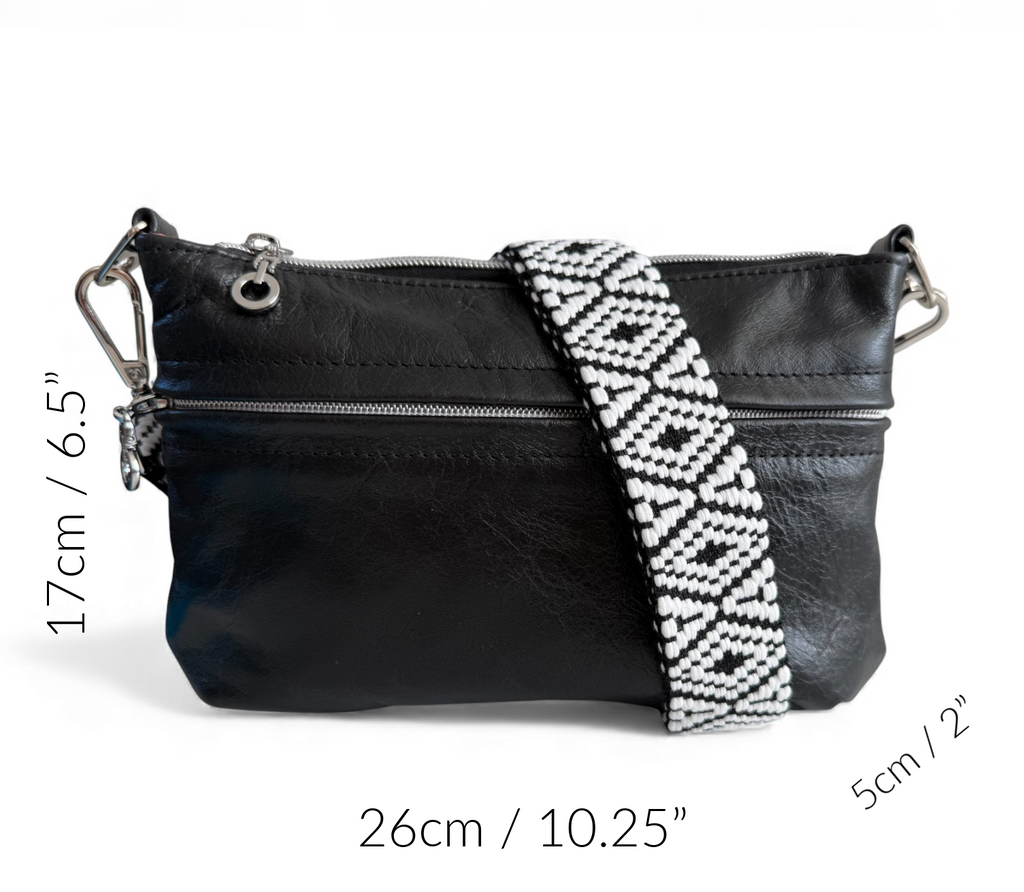 Black leather crossbody bag with a patterned strap, shown with measurements on a white background.