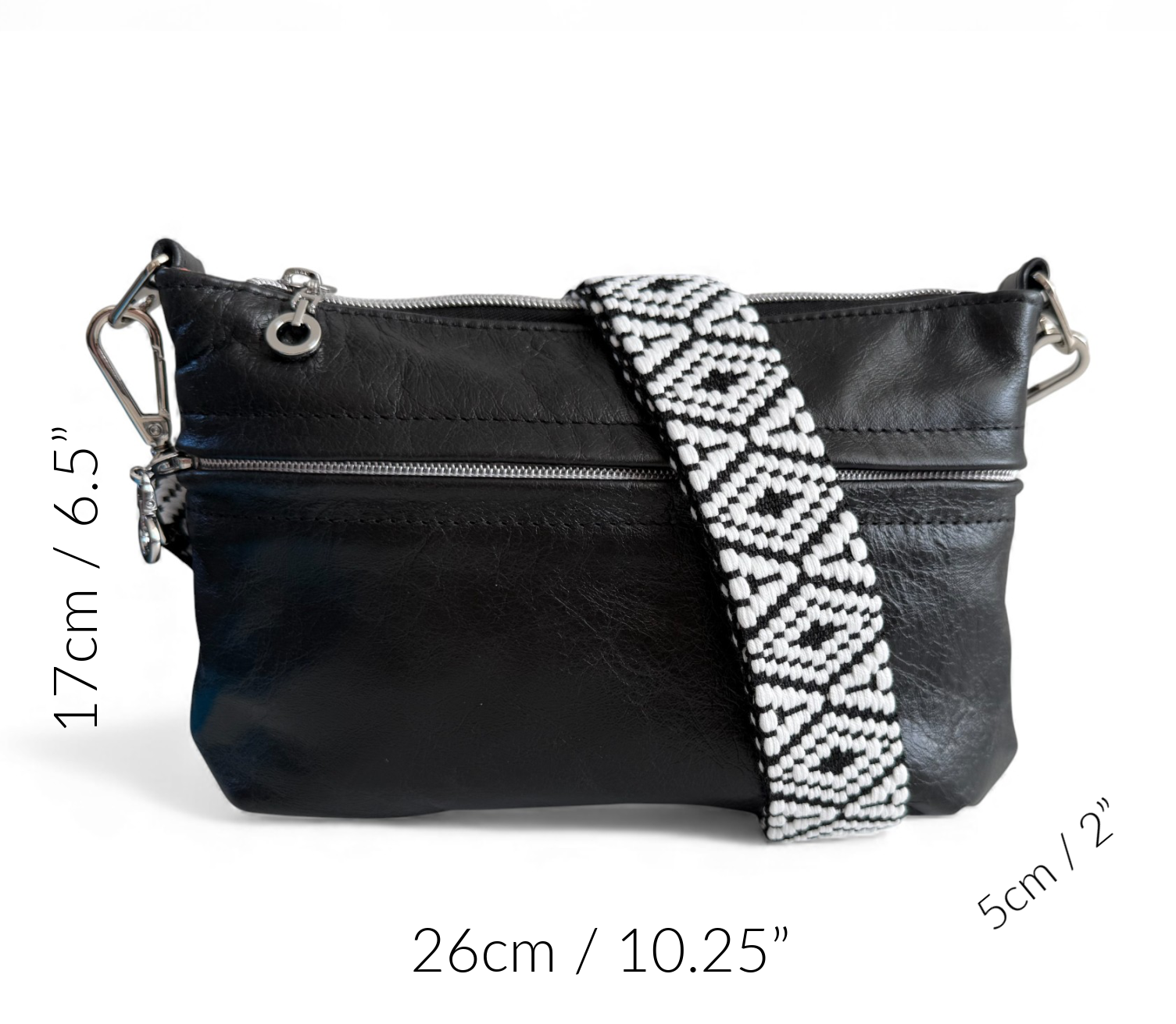 Black leather crossbody bag with a patterned strap, shown with measurements on a white background.