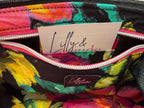 Colourful floral-patterned bag lining, showing the integrated purse, with a visible Lilly & Jude label inside.
