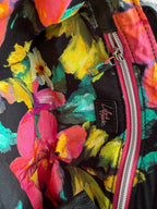 Colorful floral-patterned bag lining with a visible Lilly & Jude logo.