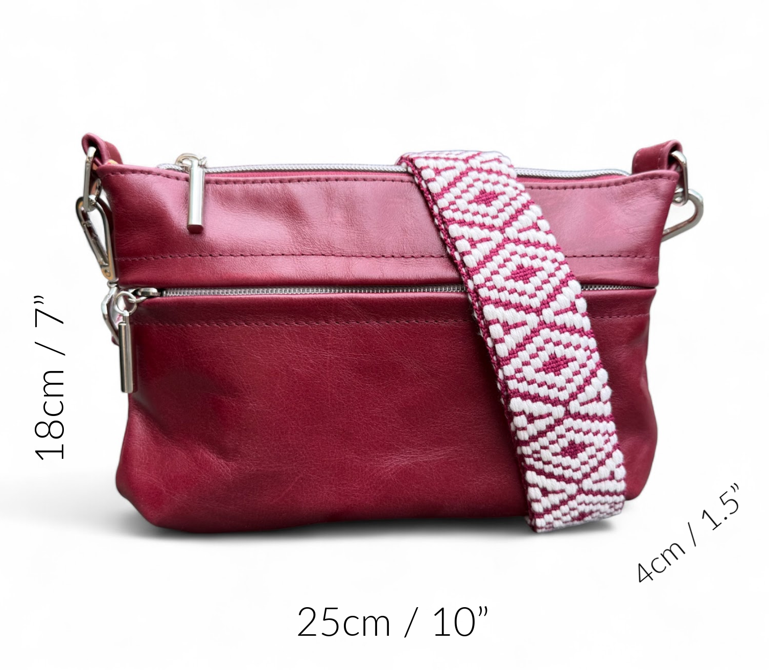 Red handbag with a patterned strap on a white background with the dimensions of the bag denoted around the edge