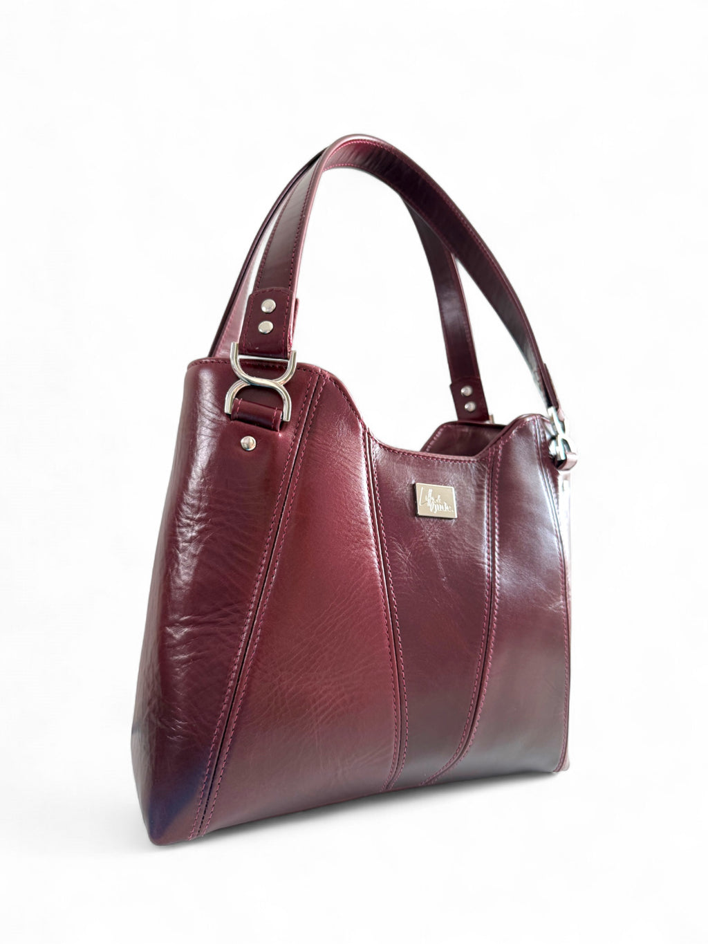 Deep red wine Alaula  handbag with silver buckle on a white background. The bag is made from genuine rescued Italian leather