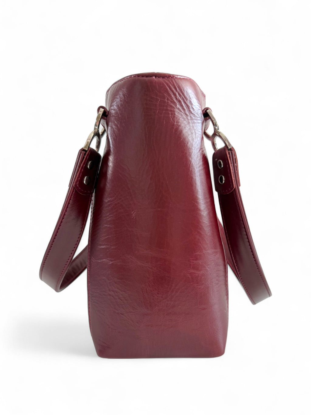 Side view of the burgundy leather Alaula handbag by Lilly and Jude. It is hand crafted using rescued leather, so is the perfect sustainable fashion bag