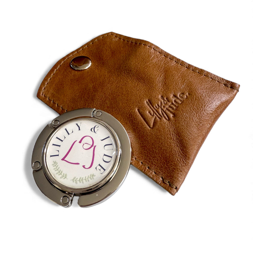 Lilly & Jude logo'd bag hook in a handcrafted leather case, to match the tan leather Alaula Handbag 