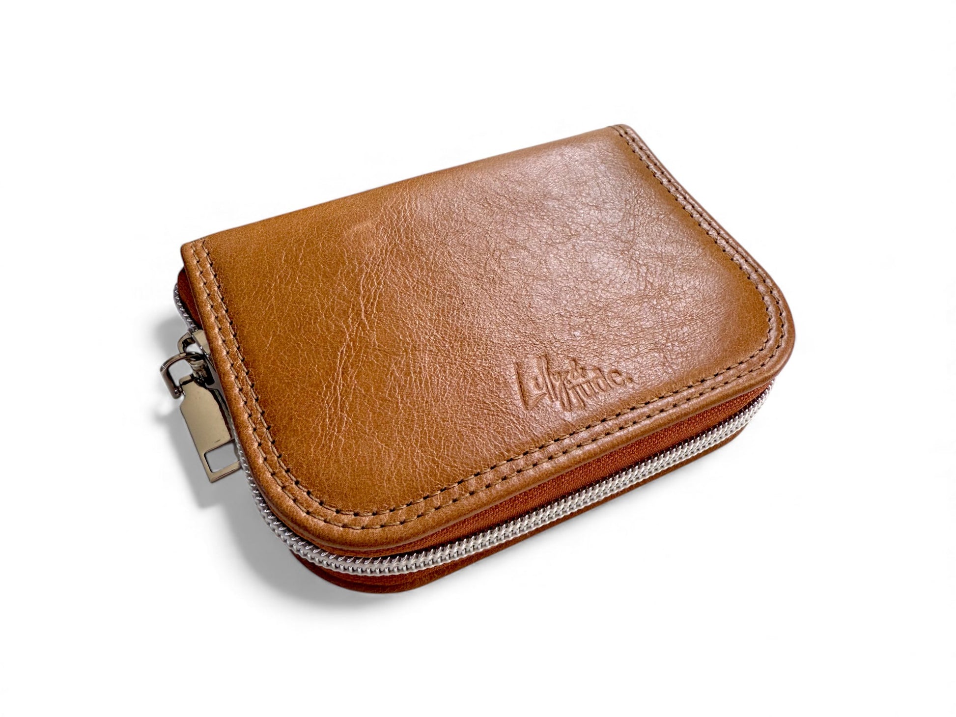 Tan brown leather wallet with a zipper on a white background