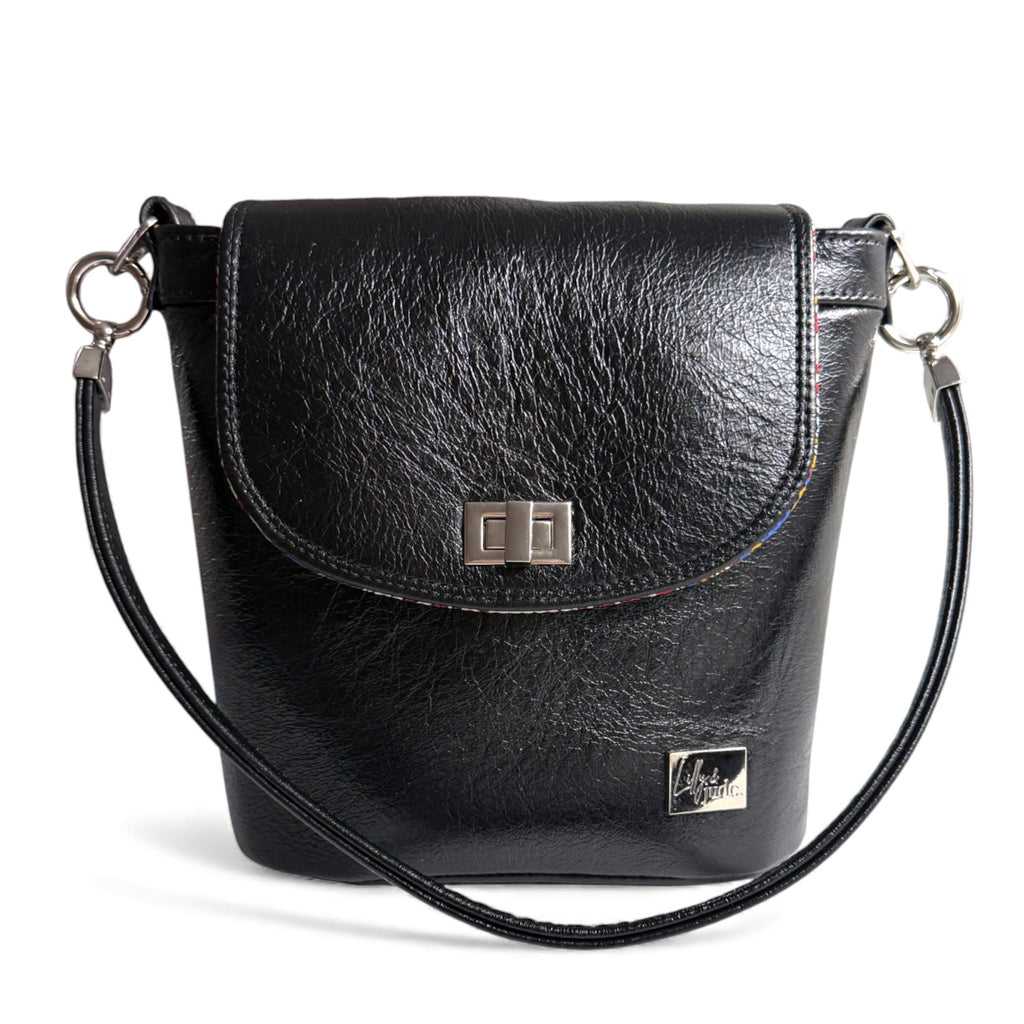 Black leather Belle bucket bag with silver hardware against a white background