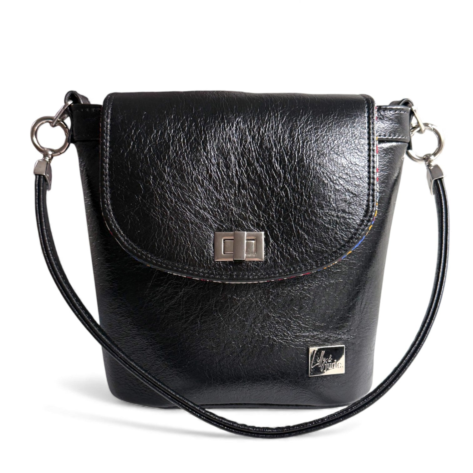 Black leather Belle bucket bag with silver hardware against a white background