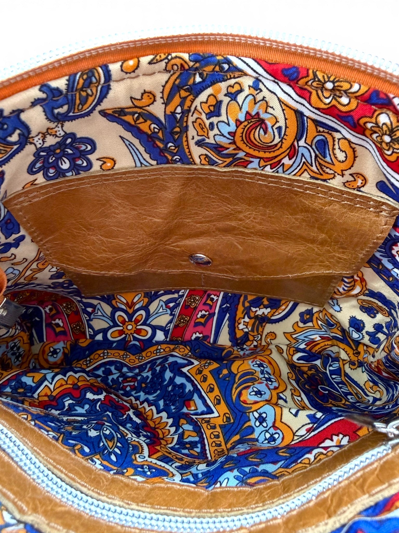 Colorful patterned lining of the Bonny  bag with an integrated purse and zipper pocket