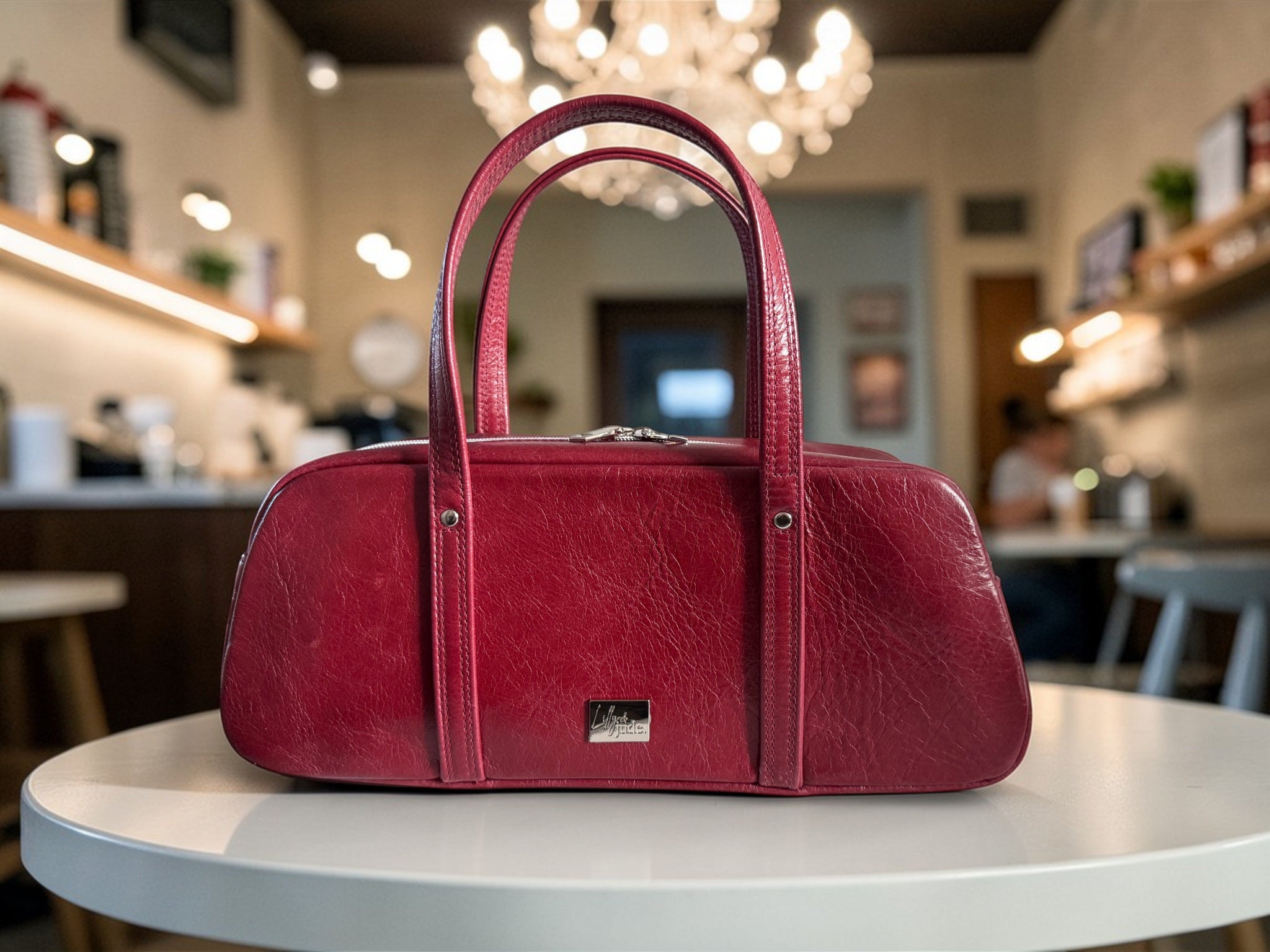 Red handbag on a table with a blurred background