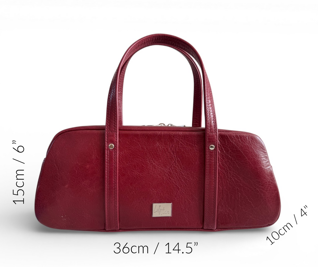 Red handbag with measurements on a white background