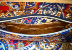 Interior view of the Cassie handbag, showing the lining fabric, slip/zip pocket and hidden, tan leather integrated purse
