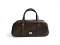 Dark green leather bowling style bag with silver hardware, against a white background