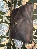 Inside view of the Cassie baguette bag, showing the floral lining fabric and the signature Lilly & Jude integrated purse