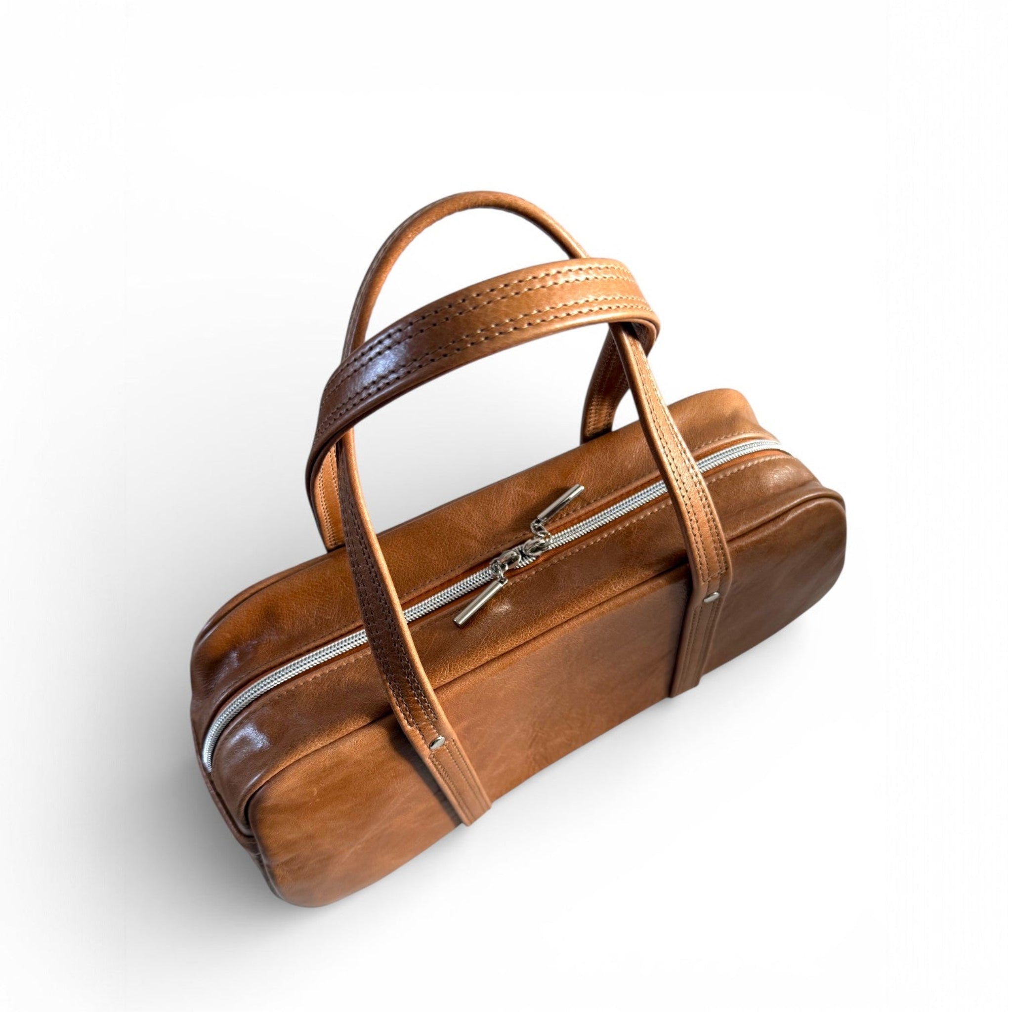 Tan brown Cassie leather bag with fixed straps on a white background