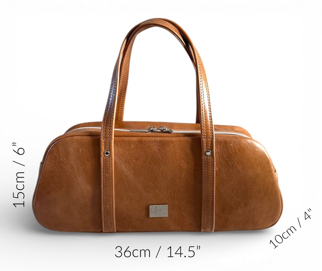 Tan brown, rescued leather handbag with measurements on a white background