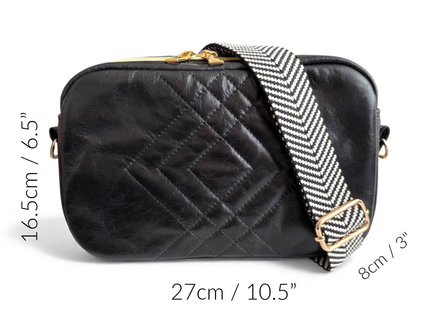 Black quilted handbag with a herringbone strap on a white background, with the dimensions of the bag around the outside