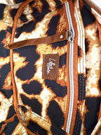Interior view of the Catalina, showing the leopard print lining, with a visible brand logo on a close-up view
