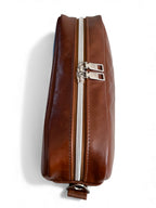 View of the top of the brown leather Catalina cross body bag, showing the zipper top and the 2 pulls. Handcrafted in the UK by Lilly & Jude