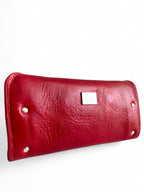 Red leather wallet with silver studs on a white background