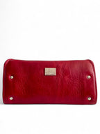 Red leather purse / wallet with silver Lilly & Jude logo badge on white background