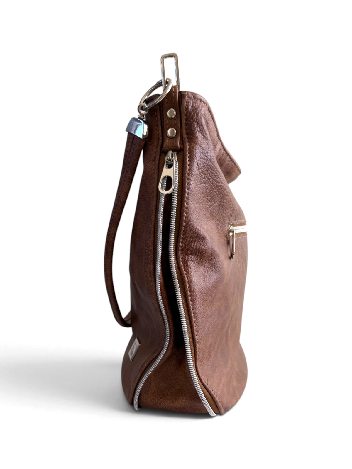 A brown leather shoulder bag shown from the side profile on a white background, featuring a silver zipper which reveals an expandable gusset