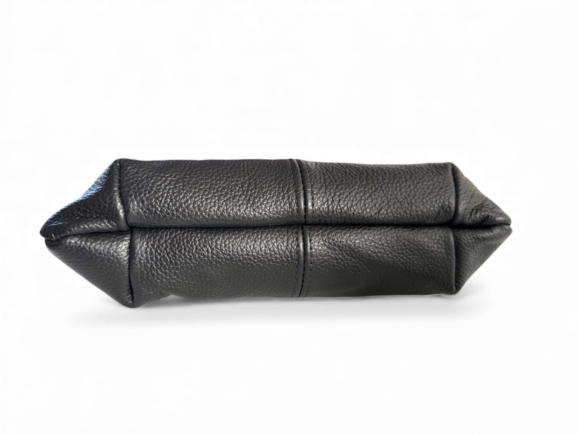 View of the bottom of the Ella wristlet bag, a Black leather clutch bag on a white background