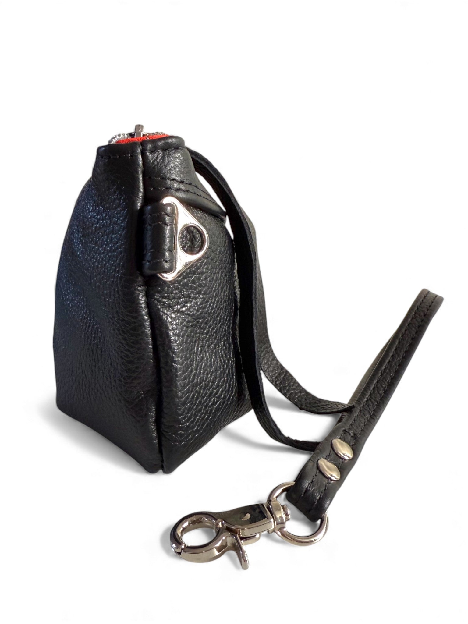 Side view of Ella, a black leather pouch with strap and metal clasp on a white background