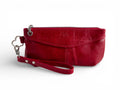 Red leather clutch with wrist strap on a white background