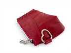 Red leather pouch with a silver heart shaped clasp on a white background