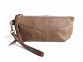 Taupe brown grey leather clutch bag with wrist strap on a white background
