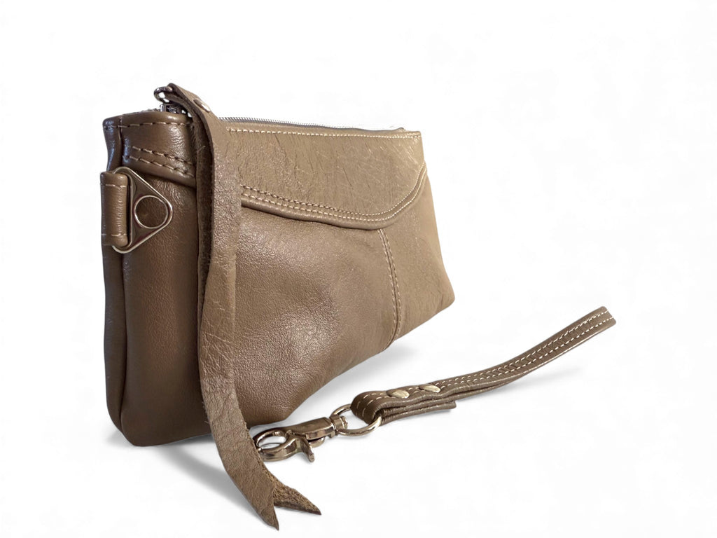Side of the taupe  leather, Ella wristlet clutch bag with a strap on a white background