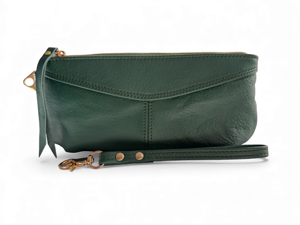 Green leather clutch with a strap on a white background