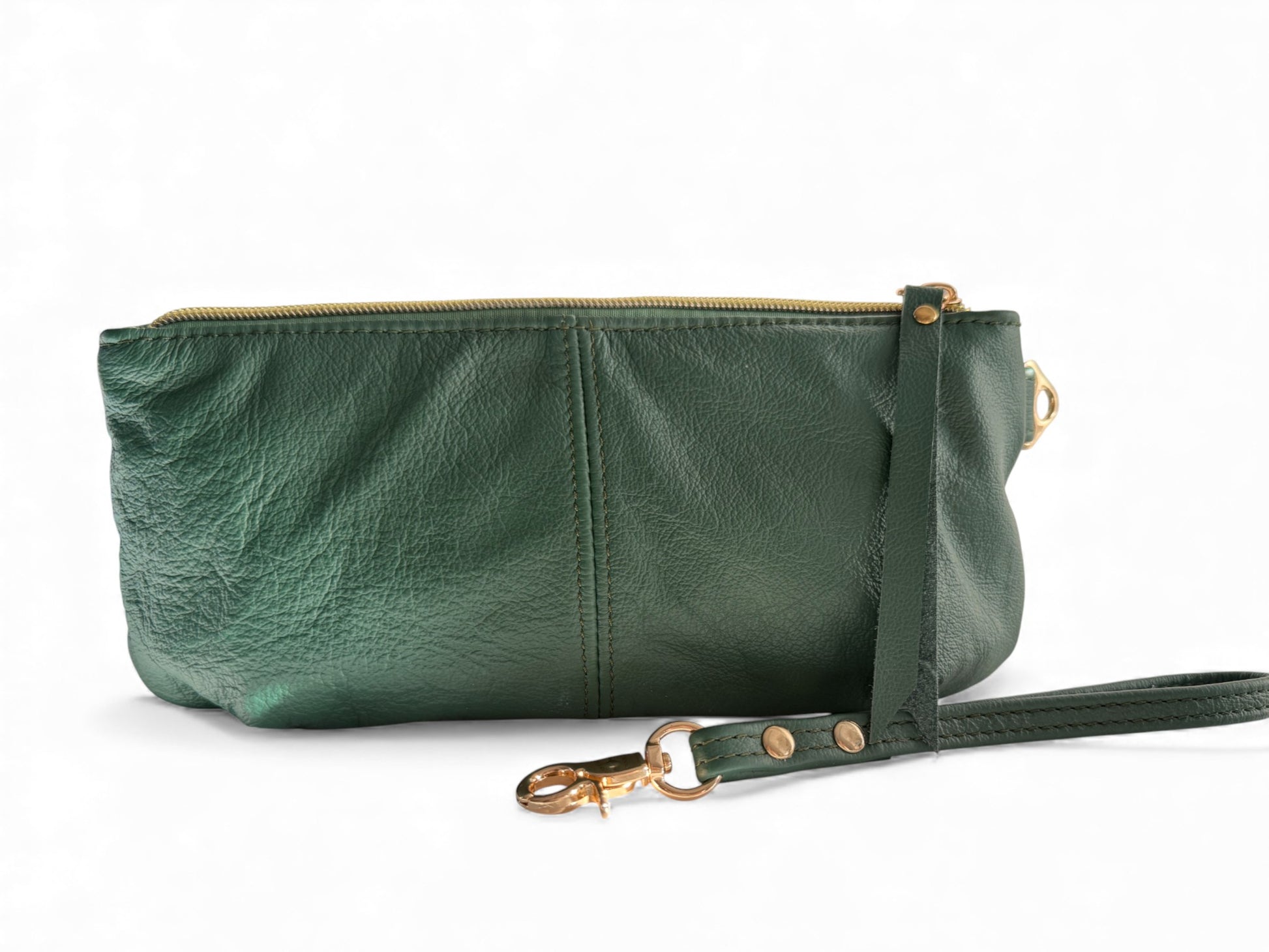View of the back of the Ella, a green leather clutch with a strap on a white background