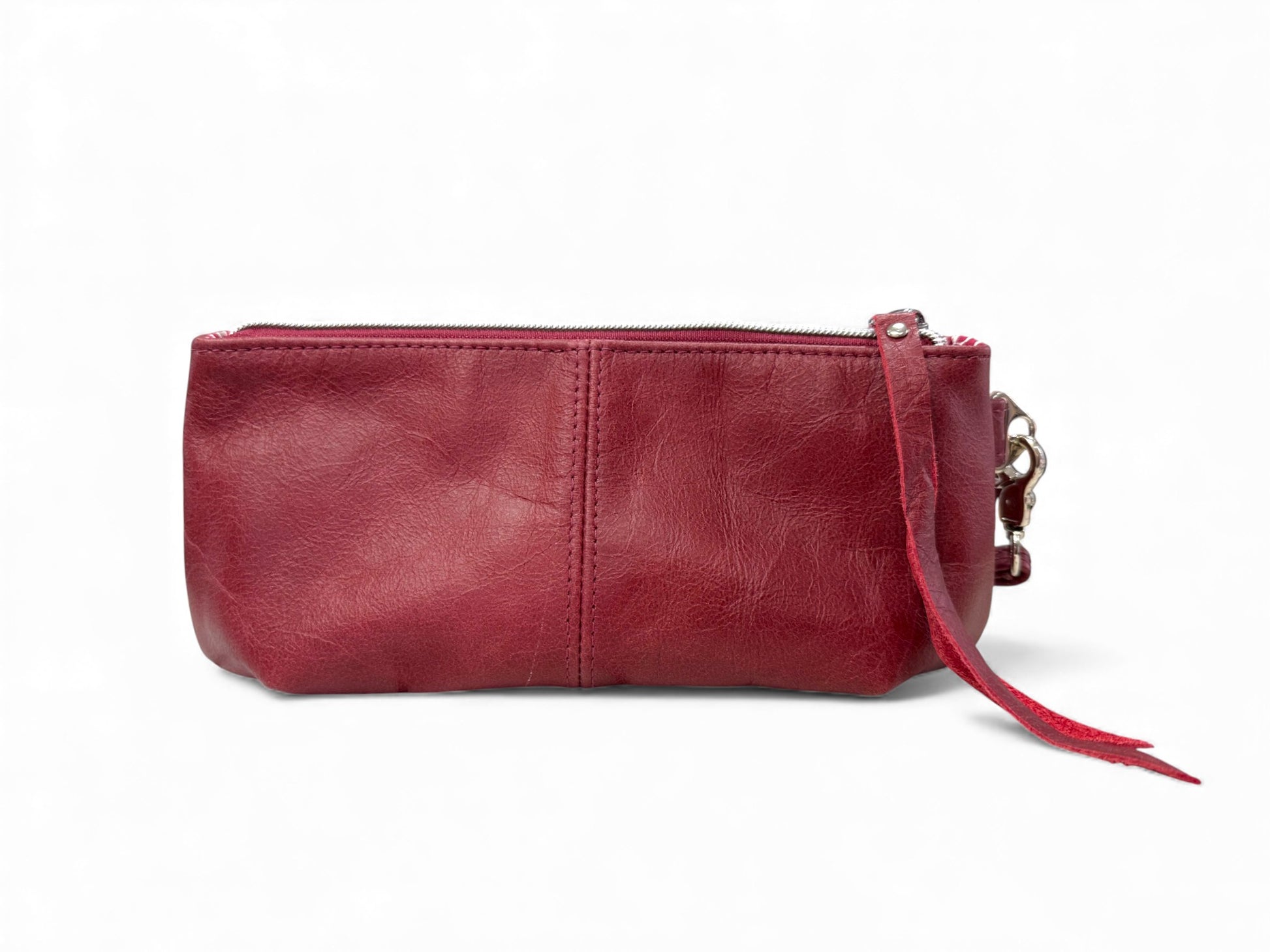 View of the back of the dark red leather Ella clutch bag  on a white background