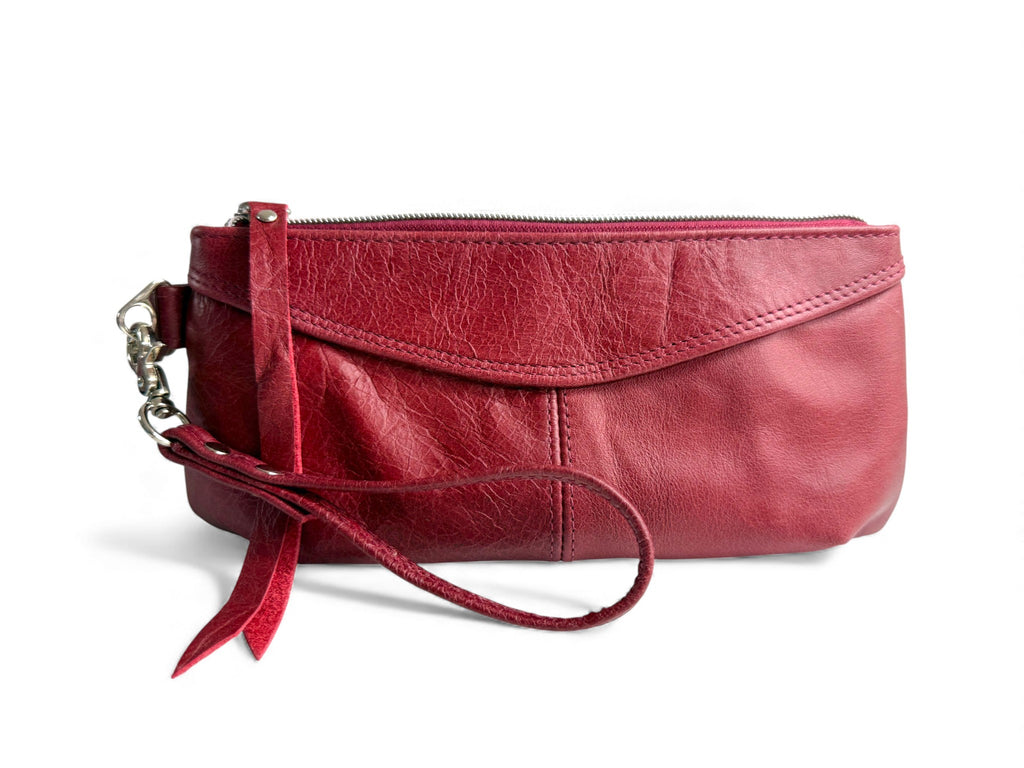 Ella wristlet evening bag. Red leather clutch with wrist strap on a white background