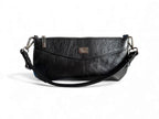 Black leather baguette style handbag with a visible Lilly&Jude  brand logo on a white background