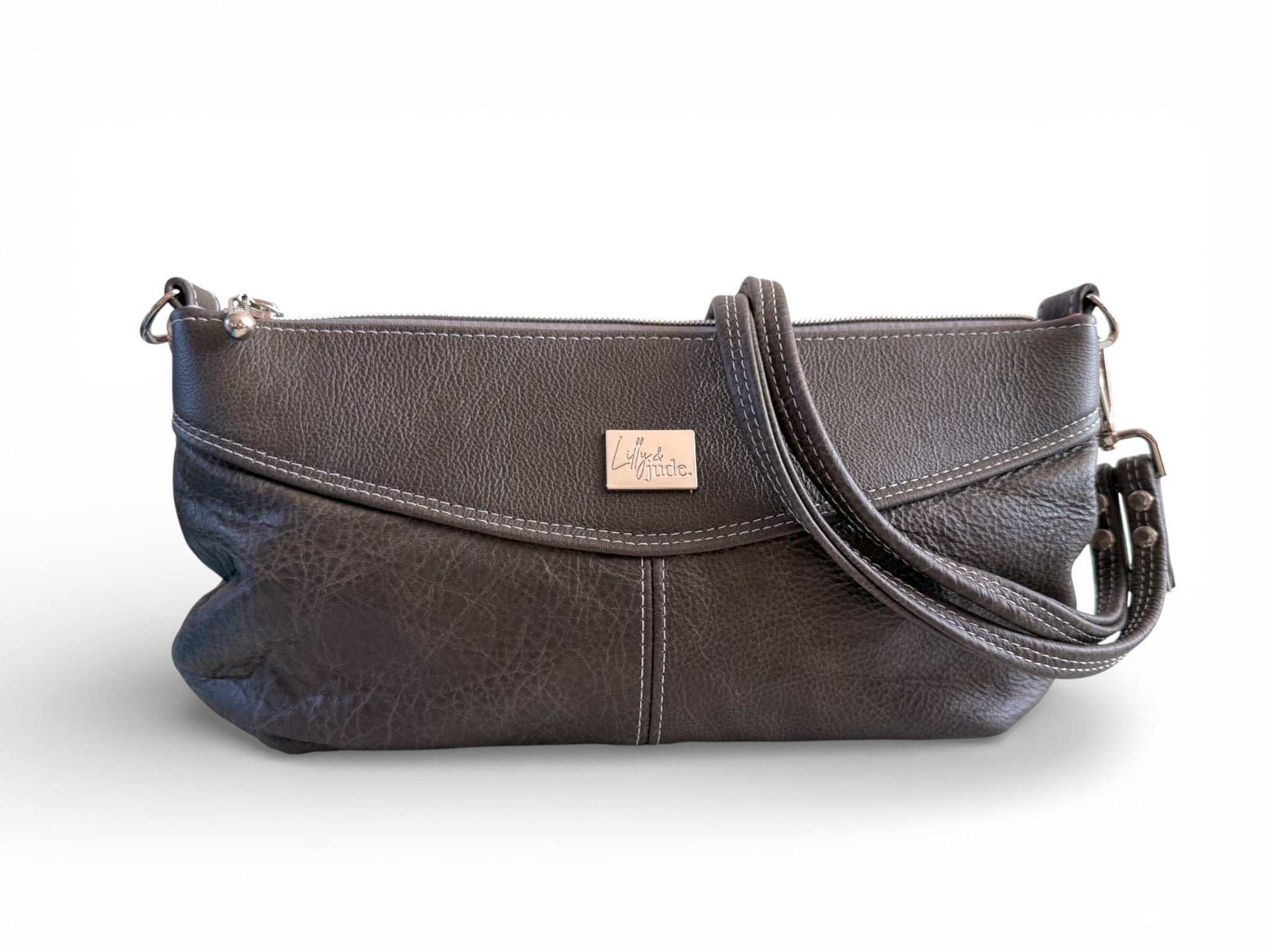 Gray leather handbag with a visible brand label on a white background