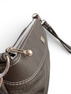 Close-up of a gray handbag withsilver hardware and a visible Lilly & Jude logo on a white background
