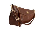 Brown leather handbag with gold accents on a white background