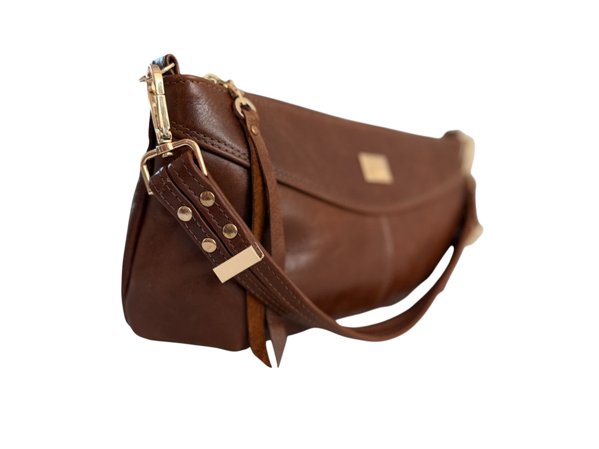 Brown leather handbag with gold accents on a white background