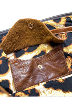 Brown leather handbag with a leopard print lining and leather integrated purse