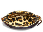 View from above of an open brown leather handbag with a leopard print lining
