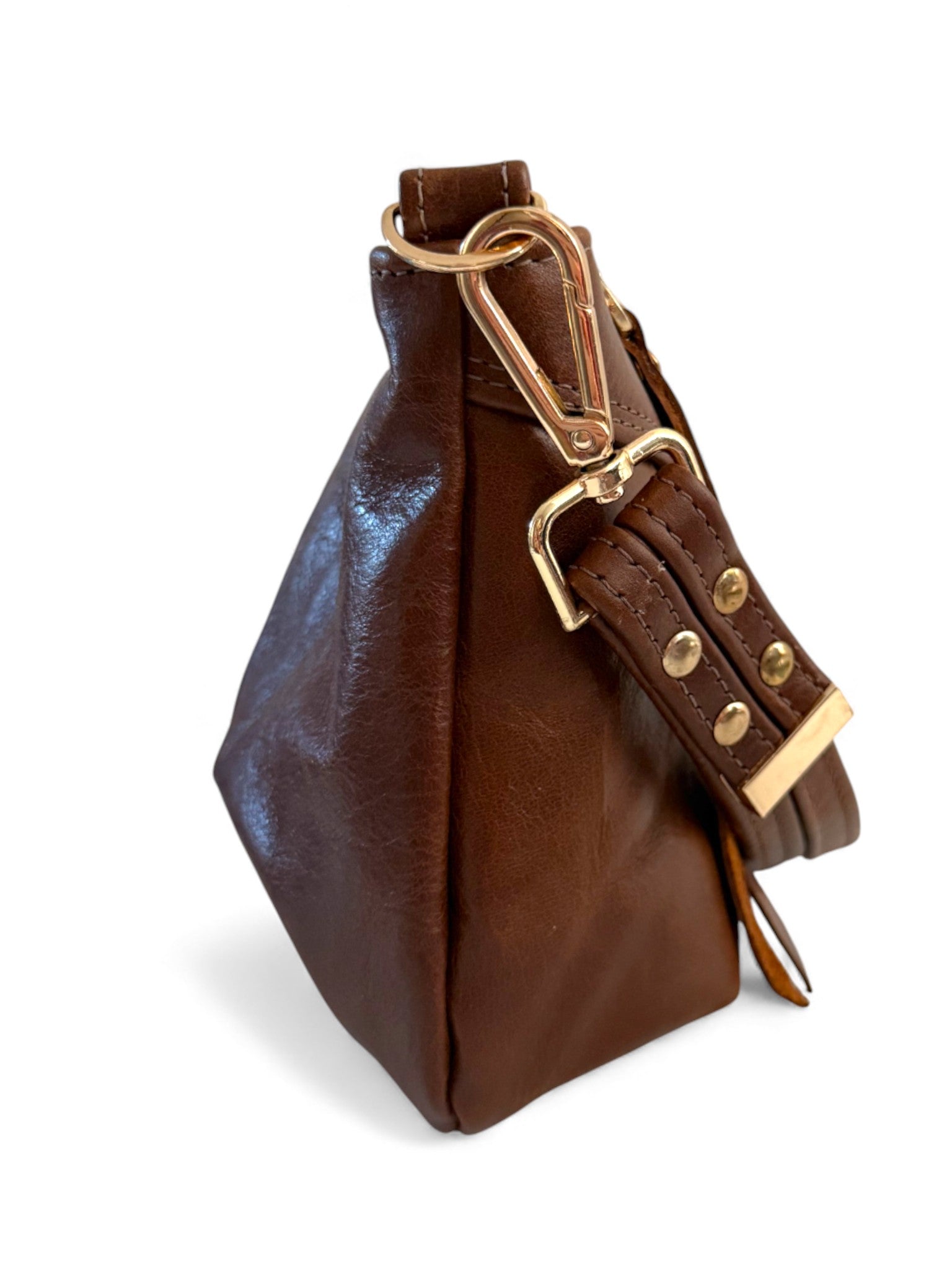 Brown leather bag with gold hardware on a white background