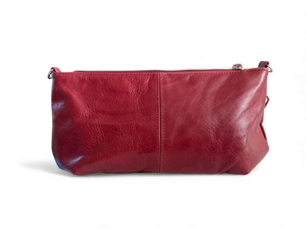 View of the back of the Elland Handbag on a white background. Handcrafted from red leather in Shropshire.