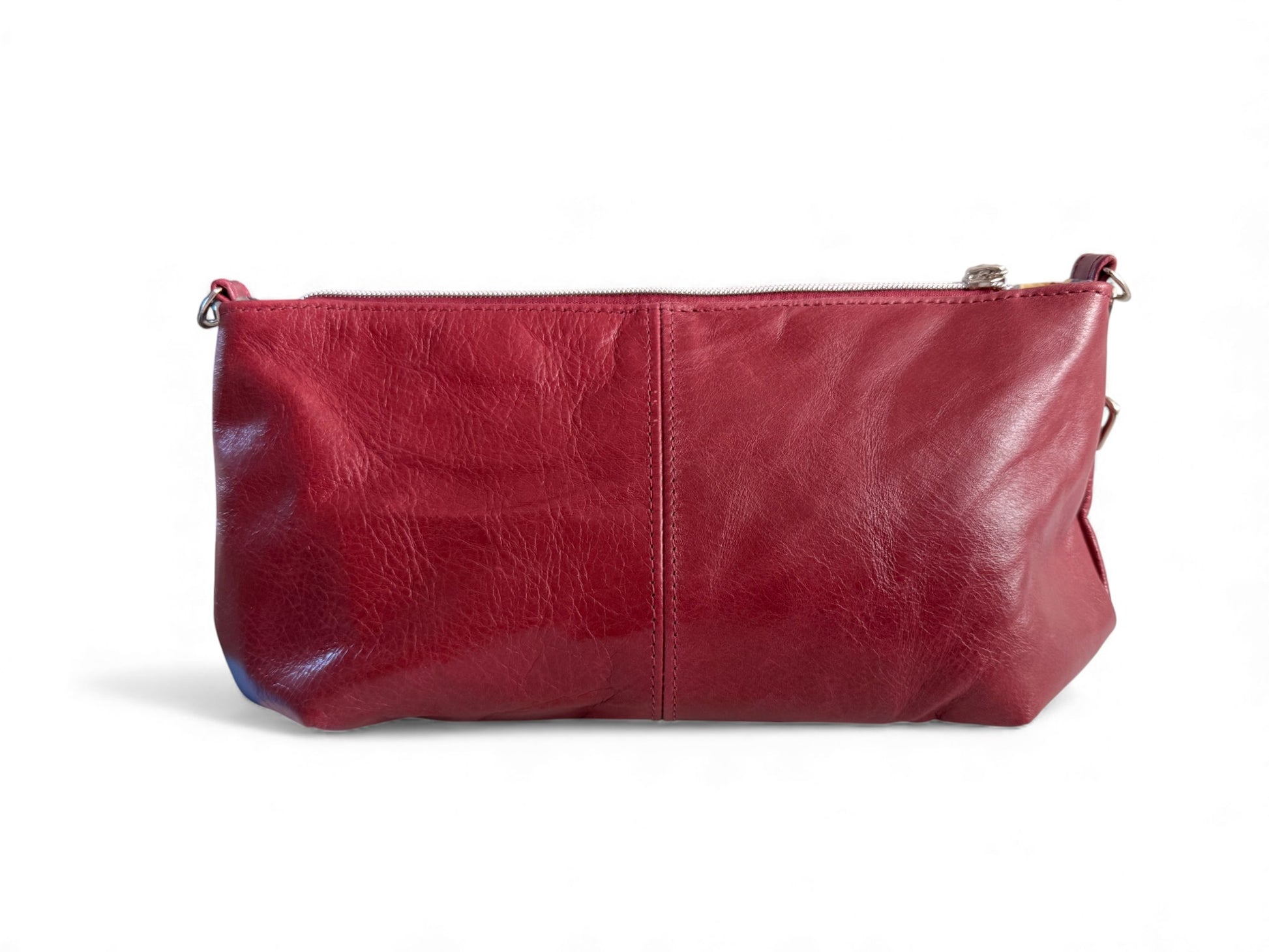 View of the back of the Elland Handbag on a white background. Handcrafted from red leather in Shropshire.